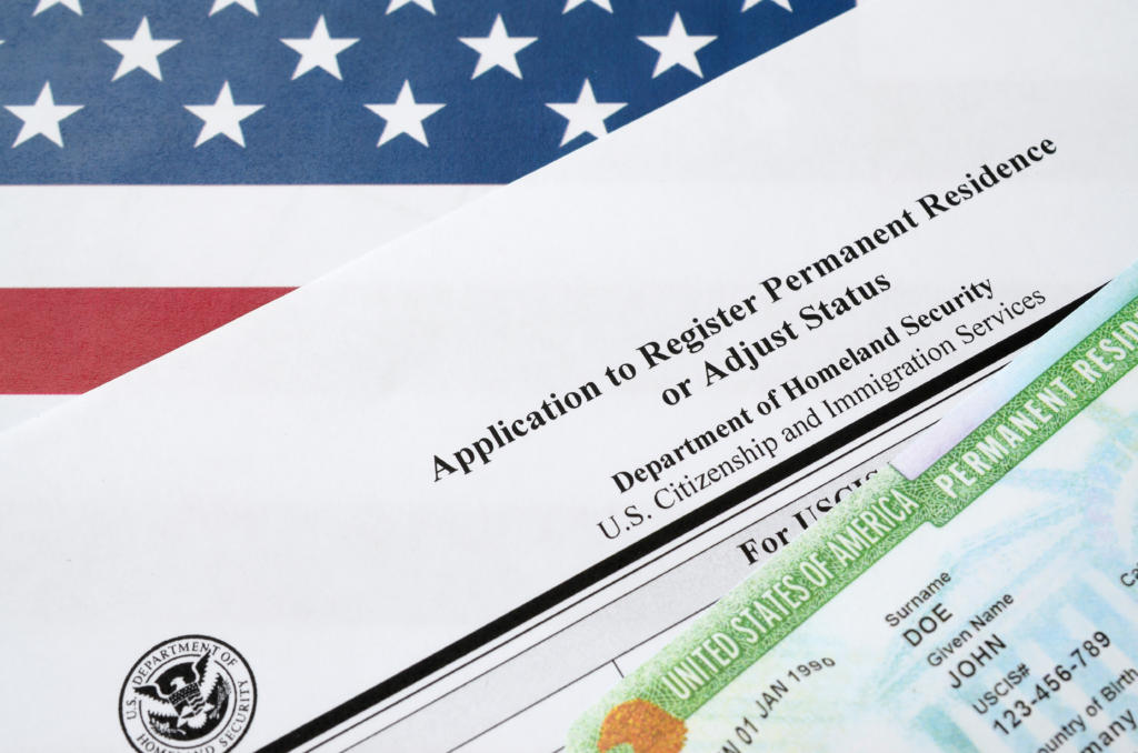 I-485 Application to register permanent residence or adjust status with immigration document in background