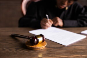 feature image USCIS Expedite Request showing judge signing documents in her chamber