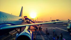 picture of a jet at airport during sunset