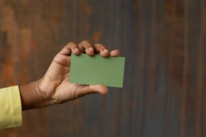 green card holder with a criminal record feature image showing woman holding green card